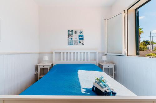 a bedroom with a bed and a swimming pool at Il Rosmarino Casa Vacanze in Taviano