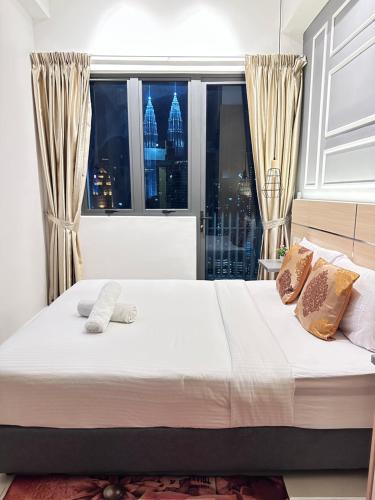 Ένα ή περισσότερα κρεβάτια σε δωμάτιο στο THE LUXE INFINITUM KLCC By KL MALAYSIA