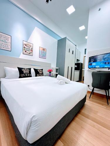 Ένα ή περισσότερα κρεβάτια σε δωμάτιο στο THE LUXE INFINITUM KLCC By KL MALAYSIA