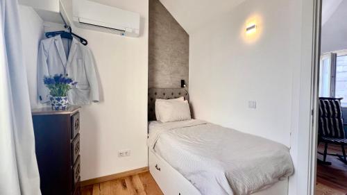 a small bedroom with a bed and a closet at Family Apartment Heart of Lisbon in Lisbon