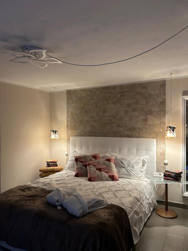 a bedroom with a large bed with two towels on it at Villa Luce in Vairano