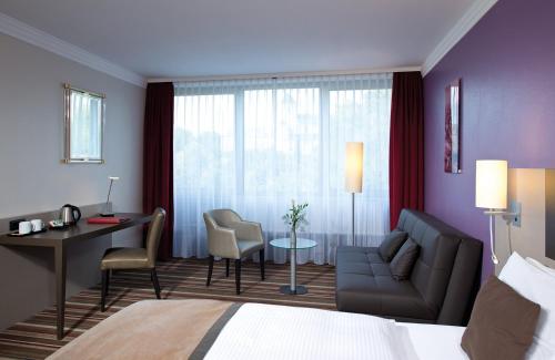 Χώρος καθιστικού στο Leonardo Hotel Mönchengladbach