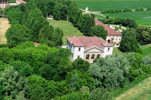 an aerial view of a large white house with a red roof at Villa Pisani Bonetti in Lonigo