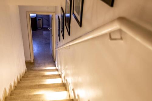 a hallway with stairs with lights on the wall at Sujimoto Shortlet Ave Forche, Banana Island, Ikoyi in Ikoyi