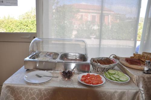 a table topped with plates of food on a table at B&B La Terrazza Degli Scrittori in Racalmuto