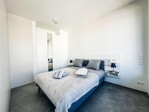 Postel nebo postele na pokoji v ubytování Wake Up Belval Millenium