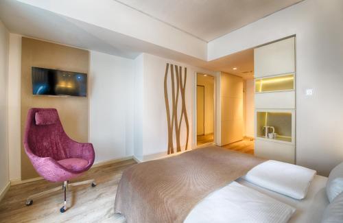 Postel nebo postele na pokoji v ubytování Leonardo Hotel Berlin Mitte