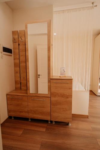 a dressing room with a mirror and a dresser at Cathedral park studio in Chişinău