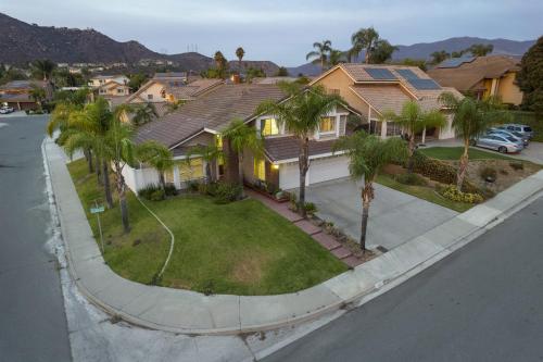 an aerial view of a house with palm trees at Entire Private 4-BR w Pool, Hot Tub, King Bed, Garage, Available Now in El Cajon