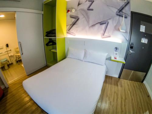 Ένα ή περισσότερα κρεβάτια σε δωμάτιο στο ibis Styles Sao Paulo Barra Funda