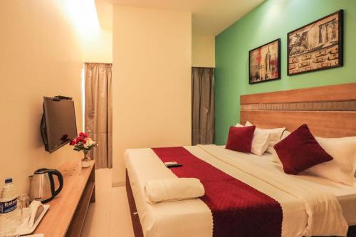 Katil atau katil-katil dalam bilik di Hotel Akasa International Near T-2 International Airport Mumbai