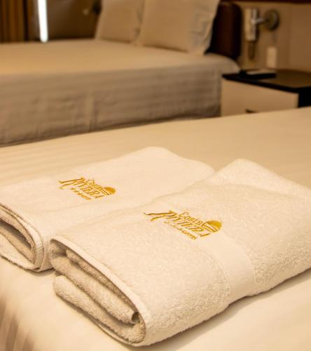 Ένα ή περισσότερα κρεβάτια σε δωμάτιο στο Hotel Costa Riviera