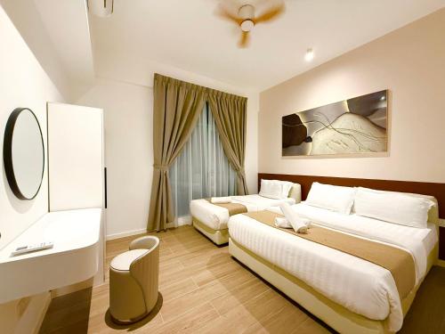 Ένα ή περισσότερα κρεβάτια σε δωμάτιο στο Bay Premier Suites by SSVC