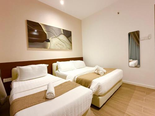 Ένα ή περισσότερα κρεβάτια σε δωμάτιο στο Bay Premier Suites by SSVC