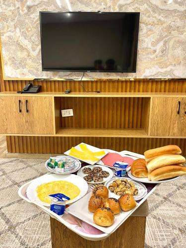 a table with different types of food on it at City plaza pyramids view in Cairo