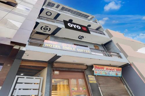 a building with a hotel smile service sign on it at Hotel O Smile Sweet Hotel in Kalkaji Devi