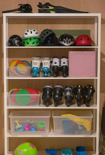 a shelf with helmets and other items on it at Family-friendly Cabin with pier - Herdla to Bergen - 40 min in Herlø