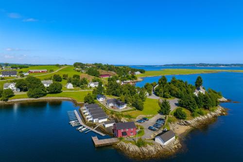 an aerial view of a home on an island in the water at Family-friendly Cabin with pier - Herdla to Bergen - 40 min in Herlø