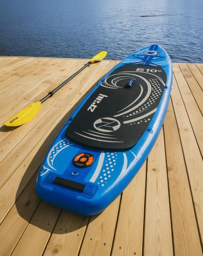 a blue kayak sitting on a dock next to the water at Family-friendly Cabin with pier - Herdla to Bergen - 40 min in Herlø