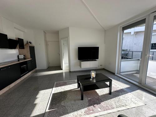 Μια τηλεόραση ή/και κέντρο ψυχαγωγίας στο BookieB Apartment by Schmitt
