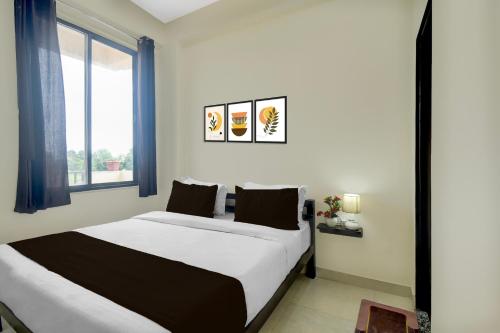Cama o camas de una habitación en Hotel O Aabha Residency