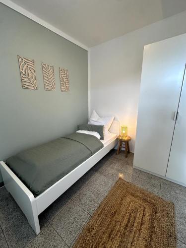 Ένα ή περισσότερα κρεβάτια σε δωμάτιο στο BookieB Apartment by Schmitt