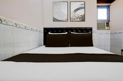 Postel nebo postele na pokoji v ubytování Hotel O Yash Lodging