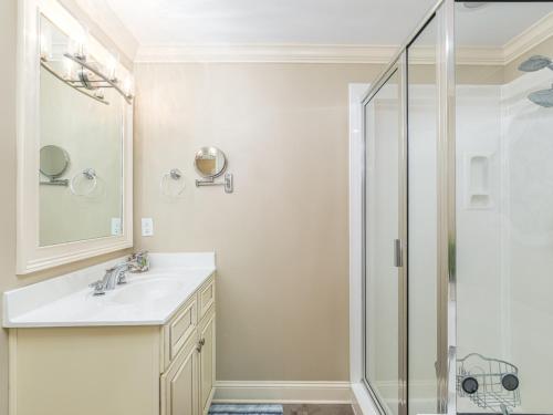 a bathroom with a sink and a shower at Brass Rail 317 in Tybee Island