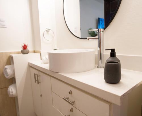 a bathroom with a sink and a mirror at Galeon House in San Rafael