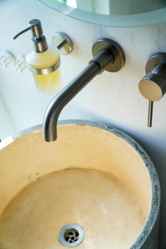 a kitchen sink with a water faucet at Corten Villa - A Vacation within Your Vacation in Saint Georgeʼs