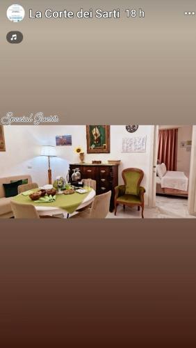 a living room with a table and a couch at La Corte dei Sarti in Copertino