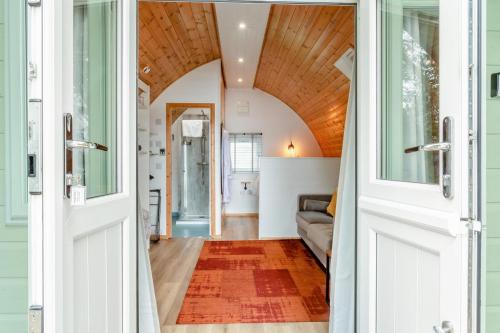 a door leading into a living room with a couch at 1 Bed in Langtoft oc-l32682 in Langtoft