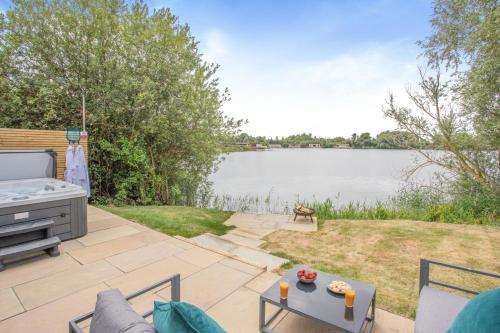 a patio with a view of a body of water at 1 Bed in Langtoft oc-l32680 in Langtoft