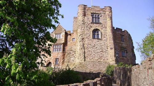 an old stone building with a tower on top at Halford House 3 Bed Town Centre Home from Home with Parking for 2 cars Prime Location Tamworth in Tamworth