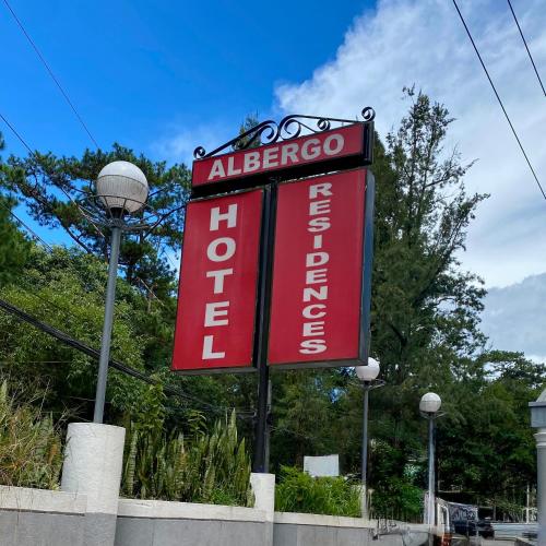 a red sign for a albergo gas station at Albergo Hotel - Studio Condo Unit - Baguio Transient in Baguio