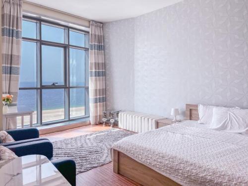 Cama o camas de una habitación en Ocean View Luxury Suites