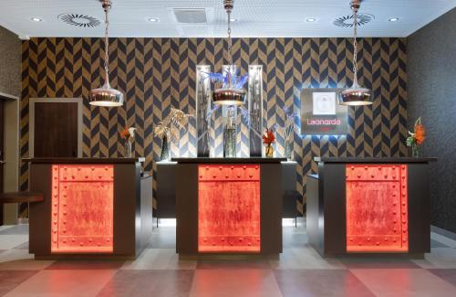a lobby with two podiums with trophies on it at Leonardo Hotel Dortmund in Dortmund