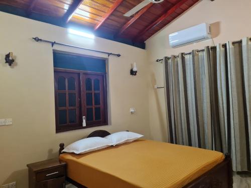 Ένα ή περισσότερα κρεβάτια σε δωμάτιο στο Ama HomeStay Guest Colombo