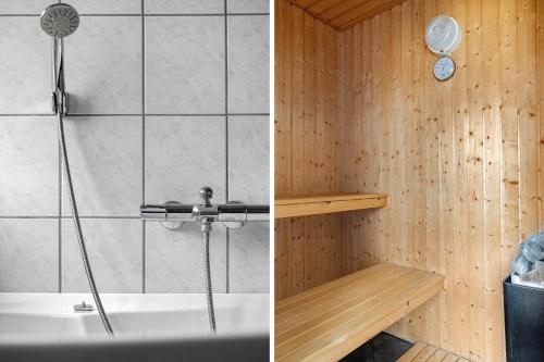 a bathroom with a shower and a bath tub at 1416-Aakirkeby-Holsteroddevej-9 in Vester Sømarken