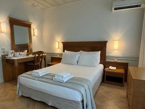 Ένα ή περισσότερα κρεβάτια σε δωμάτιο στο Hotel Ideon 