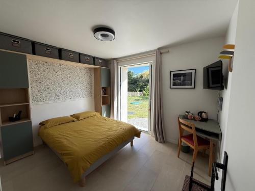 a bedroom with a bed and a window and a desk at La Belle Etape in Bangor