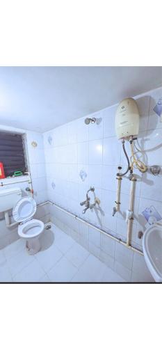 a bathroom with two toilets and a sink at Ac Private Room At Ovale Naka thane West in Jāmb