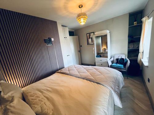 a bedroom with a large bed in a room at Cosy apartment in heart of Cork City in Cork