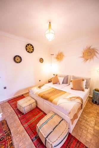 a bedroom with two beds in a room at KOUTOBIA ROYAL in Marrakech