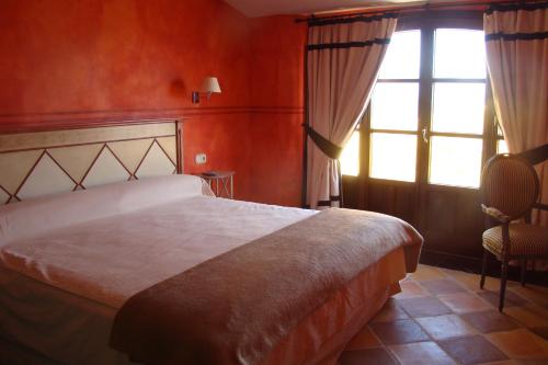 Ένα ή περισσότερα κρεβάτια σε δωμάτιο στο Hotel Casa Henrietta