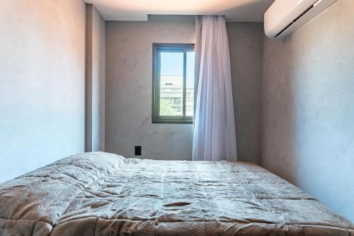 Postel nebo postele na pokoji v ubytování Praça Cinco