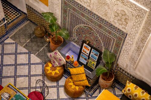 an overhead view of a tile floor with potted plants at Dar Lalamoune in Fès
