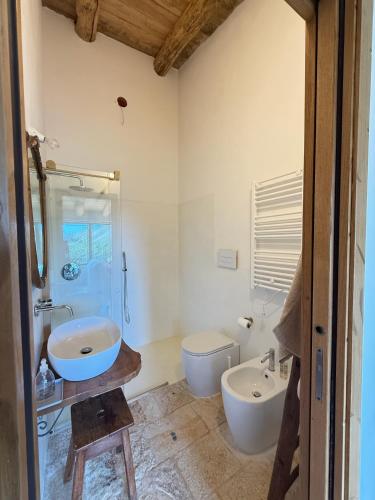 a bathroom with a sink and a toilet at Le Tre Aie in San Giovanni a Piro