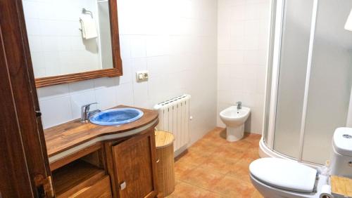 a bathroom with a sink and a toilet at Casas Rurales Ramírez in Ossa de Montiel