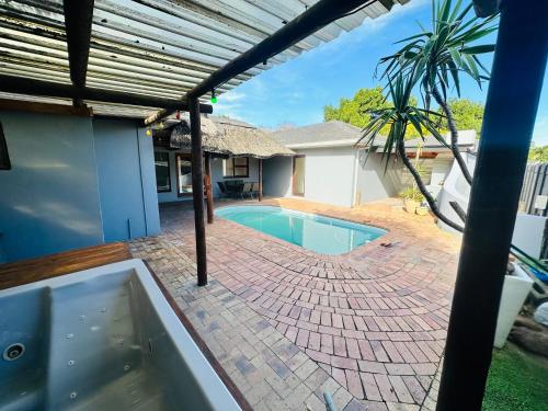 a swimming pool in the backyard of a house at Joy House in Cape Town